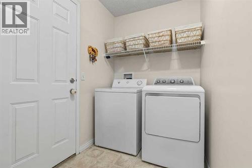 176 Cougar Ridge Circle Sw, Calgary, AB - Indoor Photo Showing Laundry Room