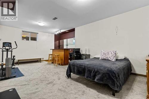 176 Cougar Ridge Circle Sw, Calgary, AB - Indoor Photo Showing Gym Room