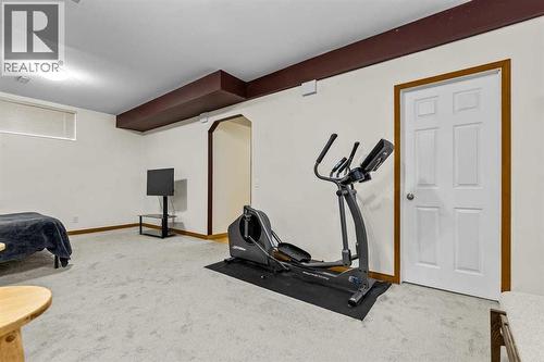 176 Cougar Ridge Circle Sw, Calgary, AB - Indoor Photo Showing Gym Room