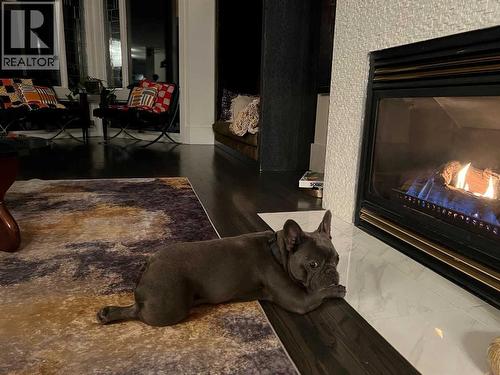 main floor family room - 31 Williams Place, Bragg Creek, AB - Indoor With Fireplace
