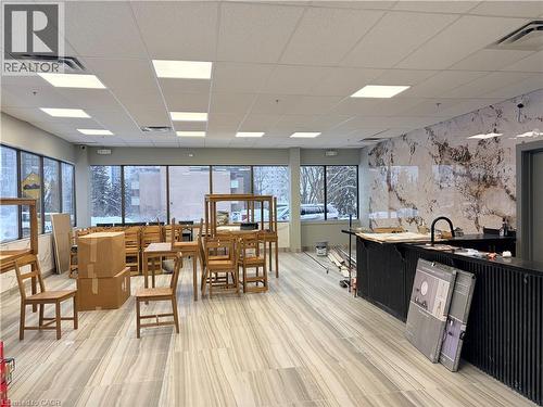 Dining room with a paneled ceiling and an accent wall - 354 King Street N Unit# 3, Waterloo, ON 