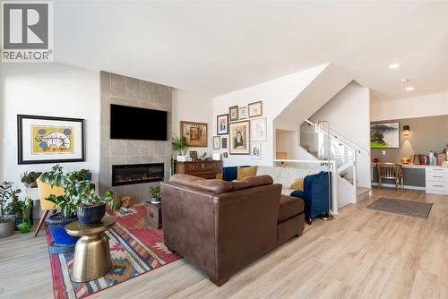 308 Grassland Boulevard W, Lethbridge, AB - Indoor Photo Showing Living Room With Fireplace