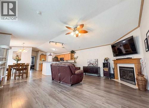 9009 90 Avenue, Grande Prairie, AB - Indoor Photo Showing Living Room With Fireplace