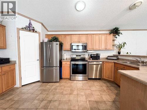 9009 90 Avenue, Grande Prairie, AB - Indoor Photo Showing Kitchen With Double Sink