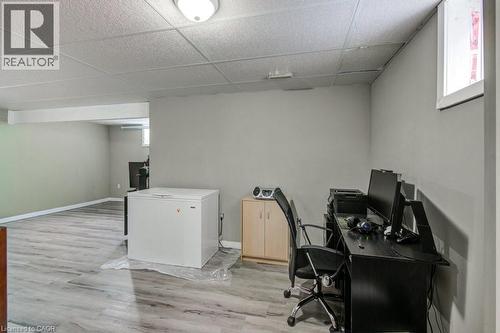 Office area with light wood-style floors and a paneled ceiling - 711 Southwood Way, Woodstock, ON - Indoor