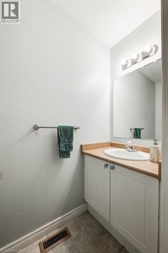 Bathroom featuring vanity and light tile patterned floors - 711 Southwood Way, Woodstock, ON - Indoor Photo Showing Bathroom