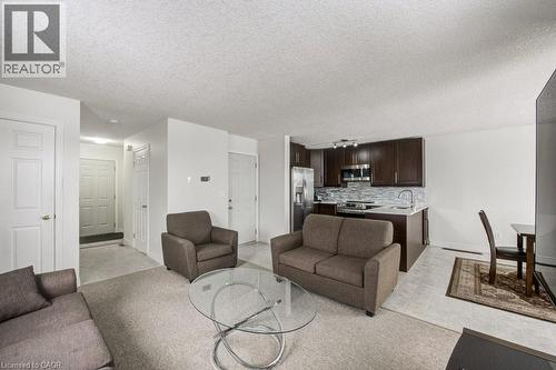 Living area with a textured ceiling - 711 Southwood Way, Woodstock, ON - Indoor Photo Showing Living Room
