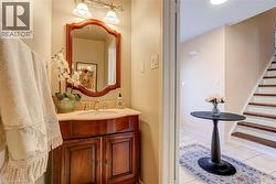 Bathroom with vanity and light tile patterned floors - 