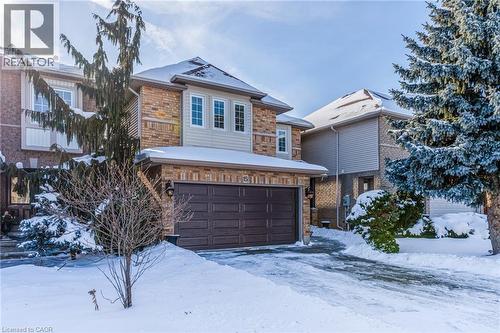 View of front of home with an attached garage and brick siding - 15 Claudette Gate, Hamilton, ON - Outdoor With Facade