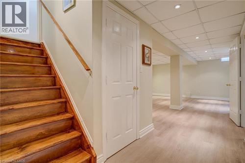 Staircase featuring a paneled ceiling, recessed lighting, and wood finished floors - 15 Claudette Gate, Hamilton, ON - Indoor Photo Showing Other Room