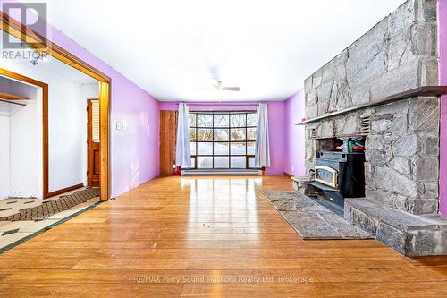 1 Old Carling Road, Carling, ON - Indoor Photo Showing Other Room With Fireplace
