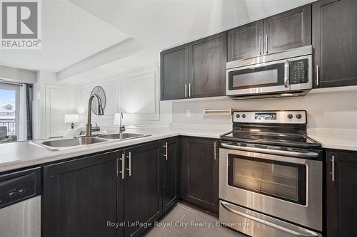 212 - 103 Westminster Crescent, Centre Wellington (Fergus), ON - Indoor Photo Showing Kitchen With Stainless Steel Kitchen With Double Sink With Upgraded Kitchen