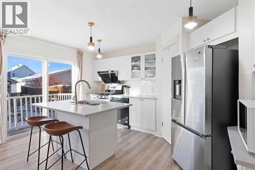 393 Tuscany Valley View Nw, Calgary, AB - Indoor Photo Showing Kitchen With Double Sink With Upgraded Kitchen