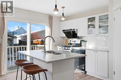 393 Tuscany Valley View Nw, Calgary, AB - Indoor Photo Showing Kitchen With Double Sink