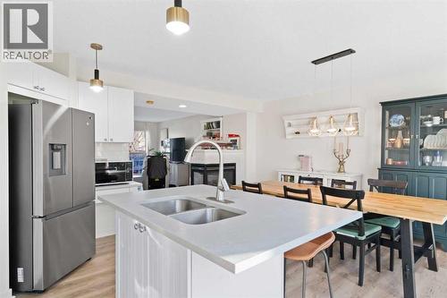 393 Tuscany Valley View Nw, Calgary, AB - Indoor Photo Showing Kitchen With Double Sink