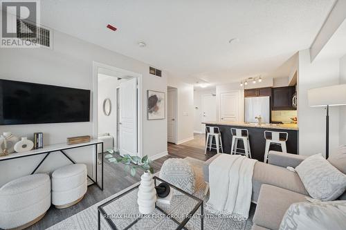 406 - 1600 Charles Street, Whitby, ON - Indoor Photo Showing Living Room