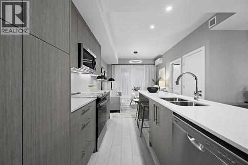 213, 310 15 Avenue Sw, Calgary, AB - Indoor Photo Showing Kitchen With Double Sink