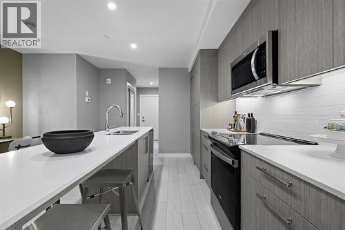 213, 310 15 Avenue Sw, Calgary, AB - Indoor Photo Showing Kitchen With Upgraded Kitchen