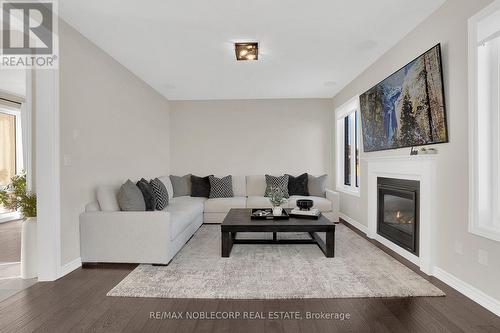 36 Felhazi Trail, Essa, ON - Indoor Photo Showing Living Room With Fireplace