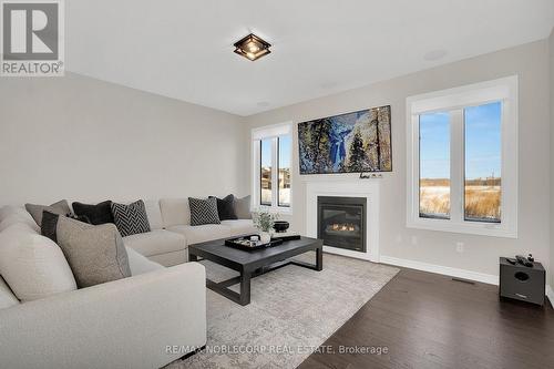 36 Felhazi Trail, Essa, ON - Indoor Photo Showing Living Room With Fireplace
