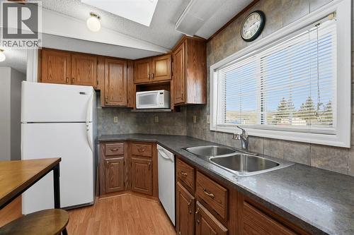 #47, 33009 Range Road 55, Rural Mountain View County, AB - Indoor Photo Showing Kitchen With Double Sink