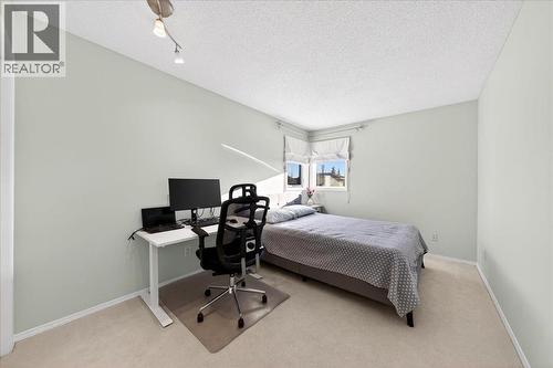 2nd bedroom - 137 Woodbrook Road Sw, Calgary, AB - Indoor Photo Showing Bedroom