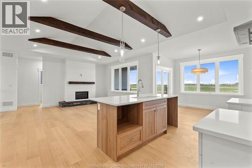 3455 Oke, Lasalle, ON - Indoor Photo Showing Kitchen With Fireplace