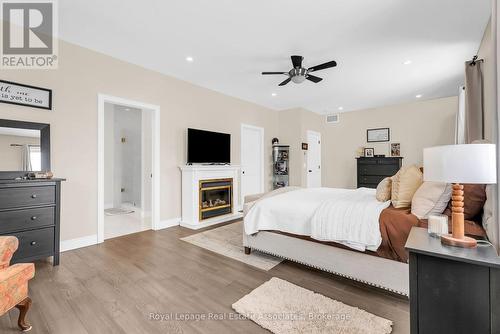 706183 County Rd 21, Mulmur, ON - Indoor Photo Showing Bedroom With Fireplace