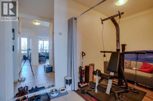 101, 8710 Horton Road Sw, Calgary, AB - Indoor Photo Showing Gym Room