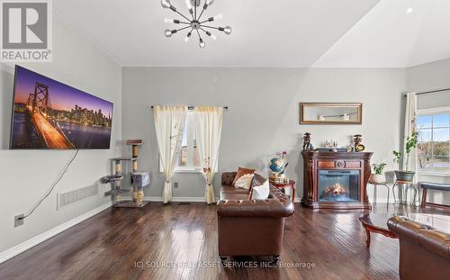 50 Songbird Crescent, Kawartha Lakes, ON - Indoor Photo Showing Living Room With Fireplace