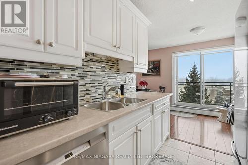 601 - 6390 Huggins Street, Niagara Falls (Stamford), ON - Indoor Photo Showing Kitchen With Double Sink