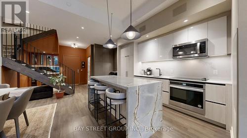 105 - 150 Logan Avenue W, Toronto, ON - Indoor Photo Showing Kitchen With Upgraded Kitchen