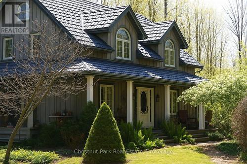 SUMMER PIC OF HOUSE PRIOR TO DECK RENOVATION - 418573 Concession A, Meaford, ON - Outdoor With Facade