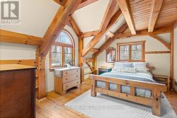 PRIMARY BEDROOM WITH VAULTED CEILINGS - 