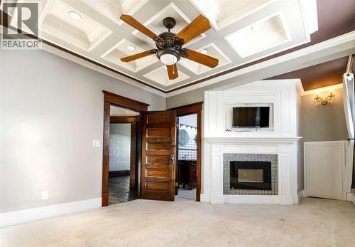 4736 56 Street, Red Deer, AB - Indoor Photo Showing Living Room With Fireplace