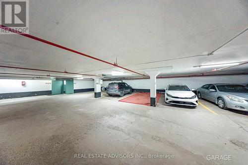 Parking spot #47 adjacent to garage entrance - 524 - 1625 Bloor Street, Mississauga, ON - Indoor Photo Showing Garage