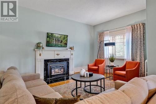 452 Hunter Street W, Peterborough (Town Ward 3), ON - Indoor Photo Showing Living Room With Fireplace