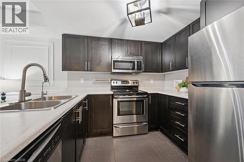 103 Westminster Crescent Unit# 212, Fergus, ON - Indoor Photo Showing Kitchen With Stainless Steel Kitchen With Double Sink With Upgraded Kitchen