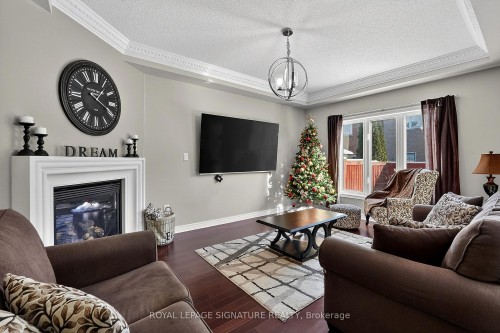 23 Openbay Gardens, Brampton, ON - Indoor Photo Showing Living Room With Fireplace