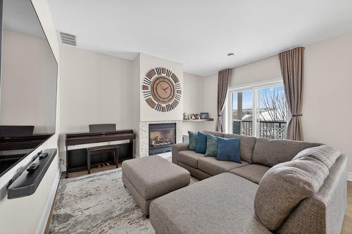 Living room - 402-2293 Rue Racine, Longueuil (Saint-Hubert), QC - Indoor Photo Showing Living Room With Fireplace