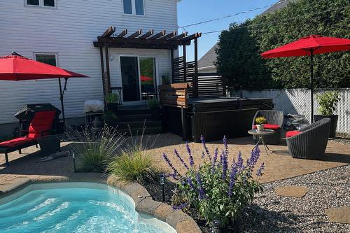 Back facade - 13715 Rue Du Noroît, Mirabel, QC - Outdoor With In Ground Pool