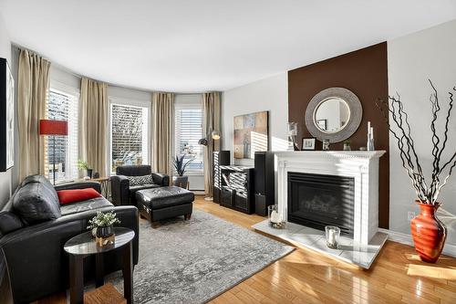 Living room - 13715 Rue Du Noroît, Mirabel, QC - Indoor Photo Showing Living Room With Fireplace