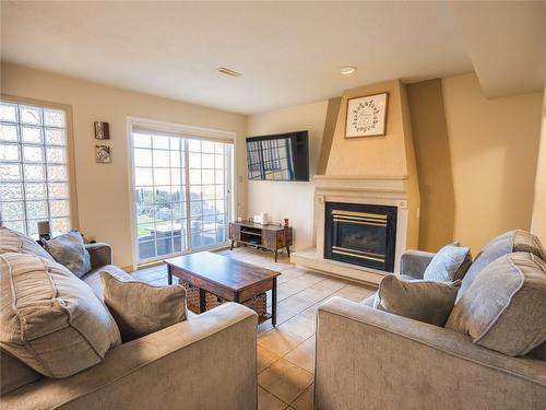 3-6811 Cottonwood Drive, Osoyoos, BC - Indoor Photo Showing Living Room With Fireplace