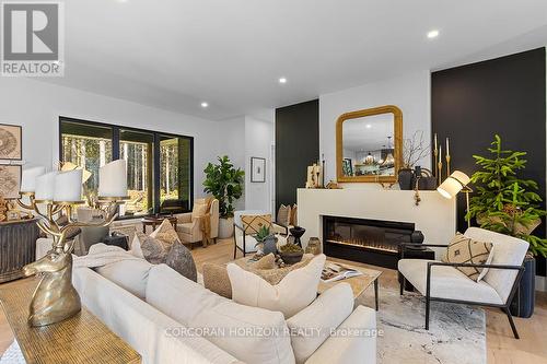 107 Louise Creek Crescent, West Grey, ON - Indoor Photo Showing Living Room With Fireplace
