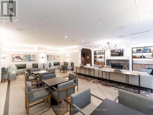 221 - 30 Inn On The Park Drive, Toronto, ON - Indoor Photo Showing Living Room With Fireplace