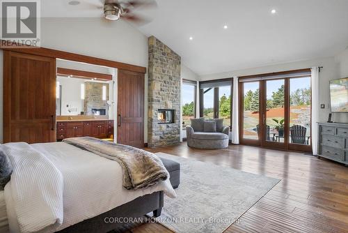 1546 Maryhill Road, Woolwich, ON - Indoor Photo Showing Bedroom With Fireplace