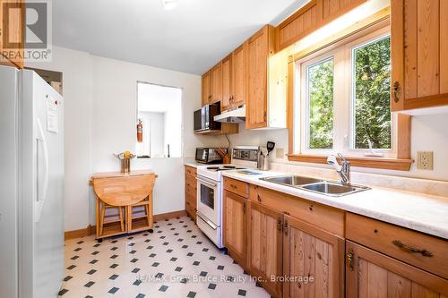 Spacious kitchen with pass-through to dining room. - 159 Zorra Drive, Northern Bruce Peninsula, ON - Indoor Photo Showing Kitchen With Double Sink