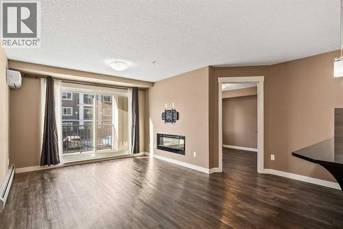 2209, 450 Sage Valley Drive Nw, Calgary, AB - Indoor With Fireplace