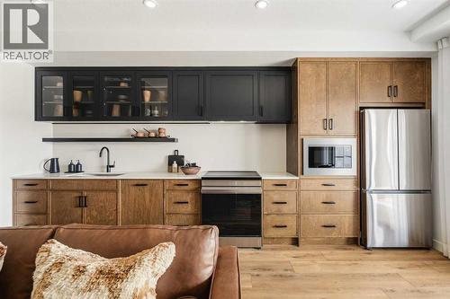3211, 1802 Mahogany Boulevard Se, Calgary, AB - Indoor Photo Showing Kitchen With Stainless Steel Kitchen