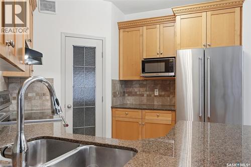 112 928 Heritage View, Saskatoon, SK - Indoor Photo Showing Kitchen With Double Sink